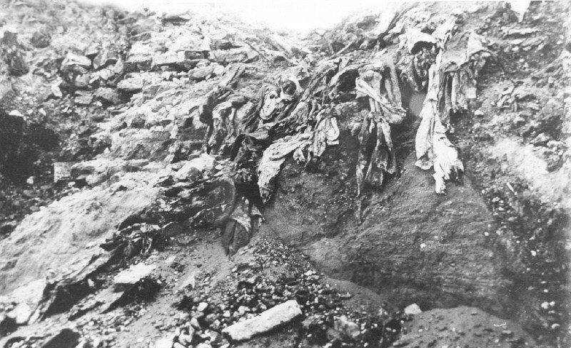 A pit at the Ponary mass extermination site near Vilnius (Vilna), containing shreds of clothing and the remains of the murdered victims themselves.